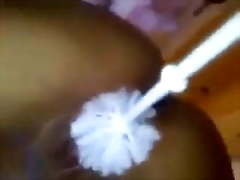 Teen girl fucks her pussy with toilet brush