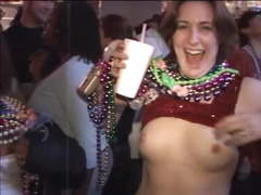 Girls expose breasts for beads at Mardi Gras